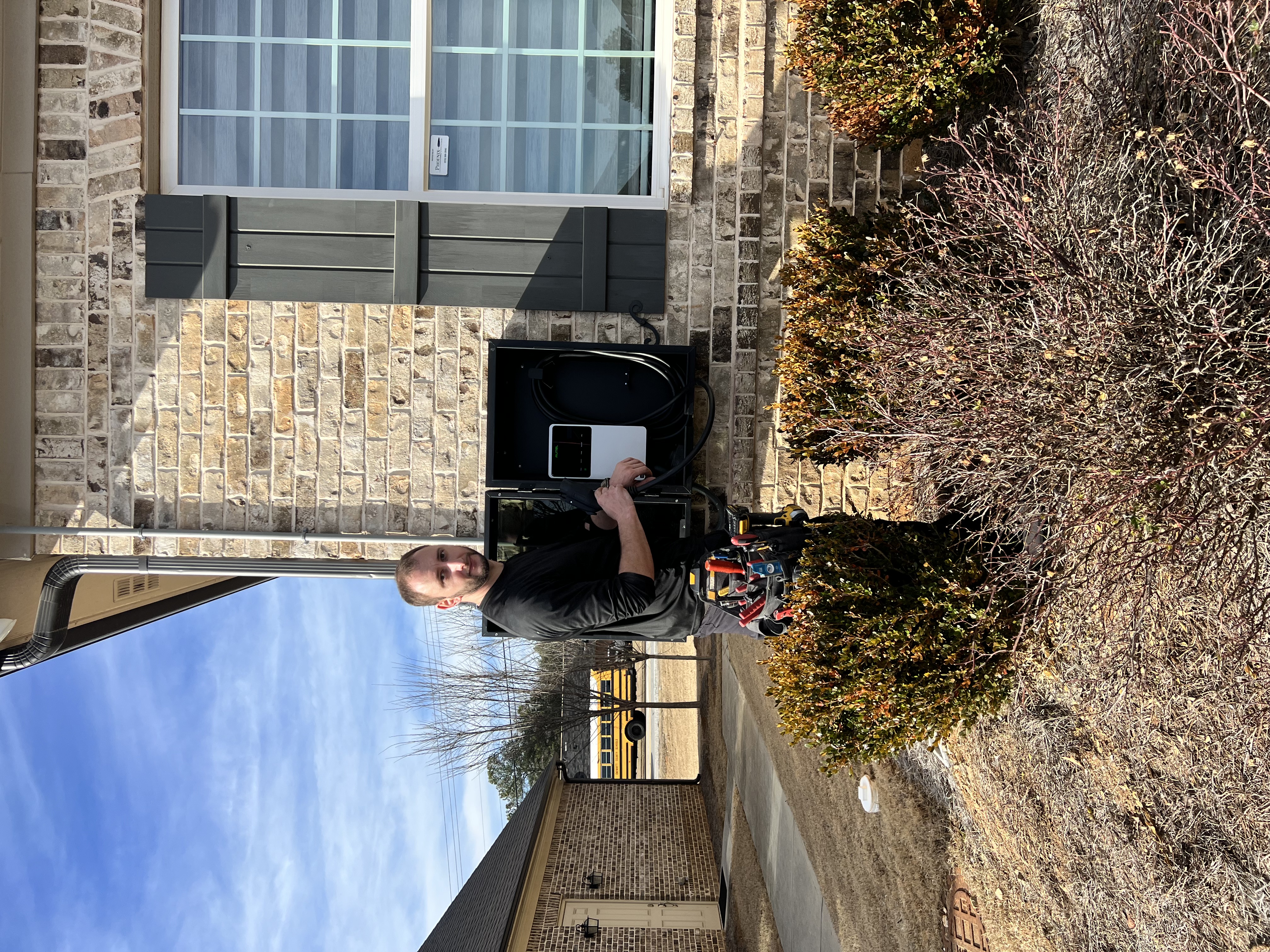Eli-energy technician installing EV charger at residential home in Kennesaw GA