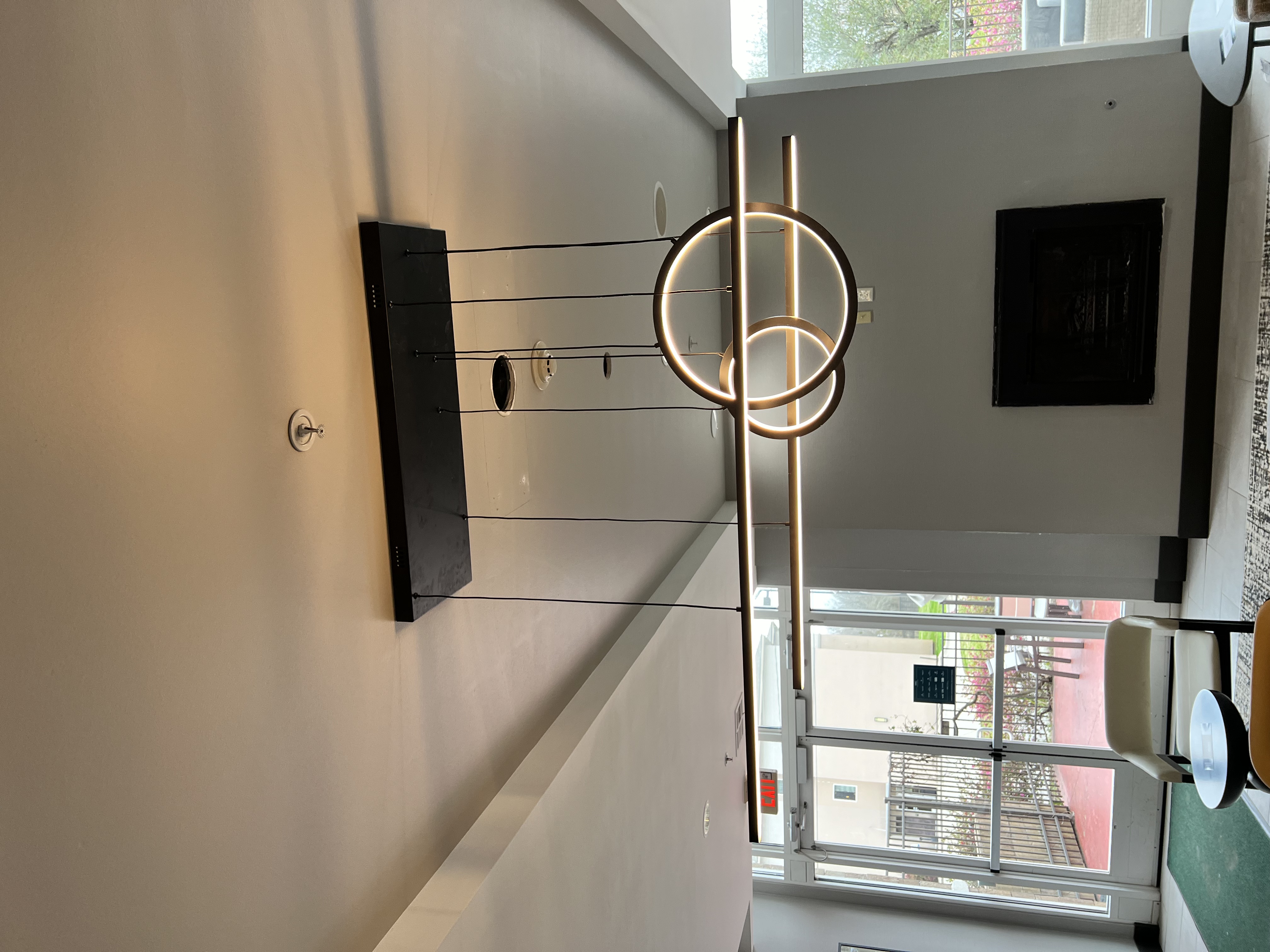 Modern LED ring chandelier installation by Eli-energy electrician